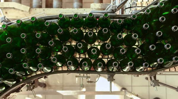 Many bottles on conveyor belt — Stock Photo, Image