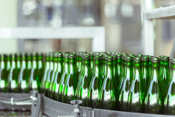 Many bottles on conveyor belt — Stock Photo, Image