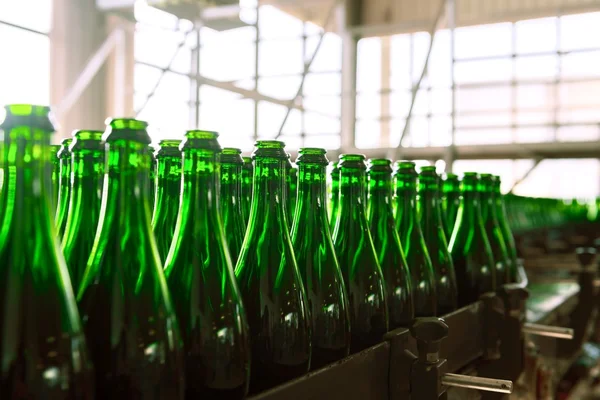 Many bottles on conveyor belt — Stock Photo, Image