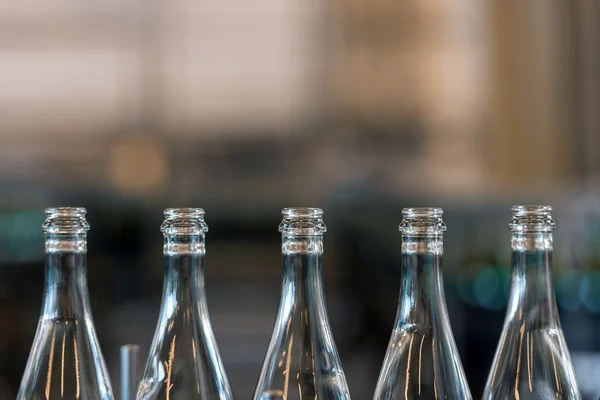 Many bottles on conveyor belt — Stock Photo, Image