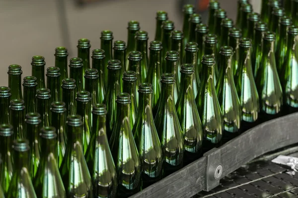 Many bottles on conveyor belt — Stock Photo, Image