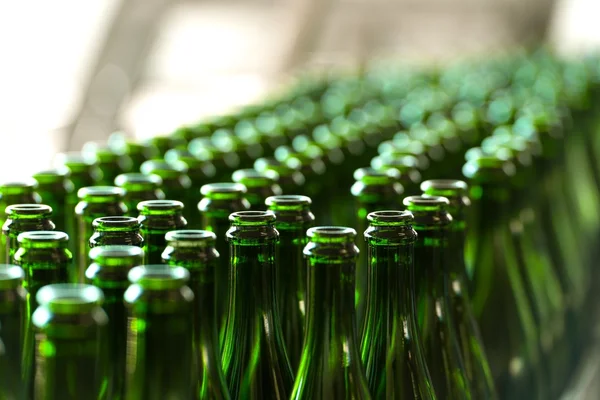 Many bottles on conveyor belt — Stock Photo, Image