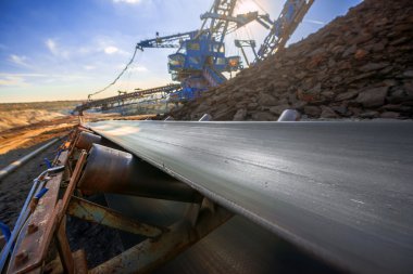 Long conveyor belt transporting ore clipart