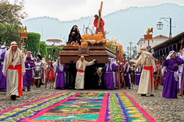 The Good Friday Procession during Holy Week (Semana Santa) in UNESCO World Heritage Site Antigua, Guatemala - 22nd of April 2011 clipart