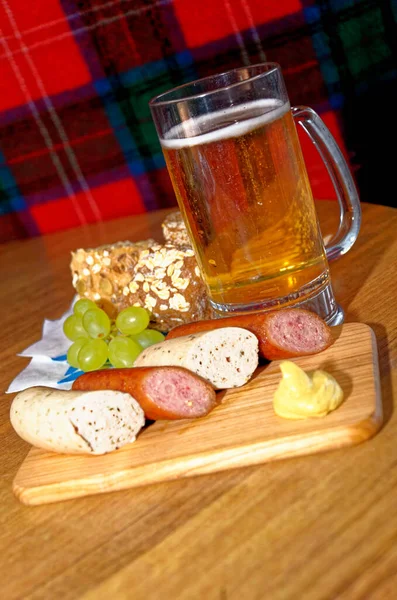 German cuisine - selection of german sausages on vintage wooden background