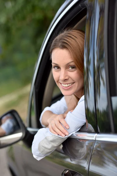 Woman sitting at streering wheel — Stock Photo, Image