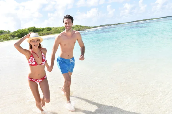 Cheerful couple running — Stock Photo, Image