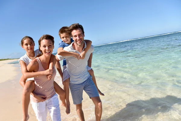 Parents giving piggyback ride — Stock Photo, Image