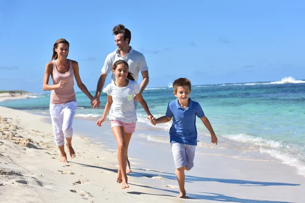 Family of four walking — Stock Photo, Image