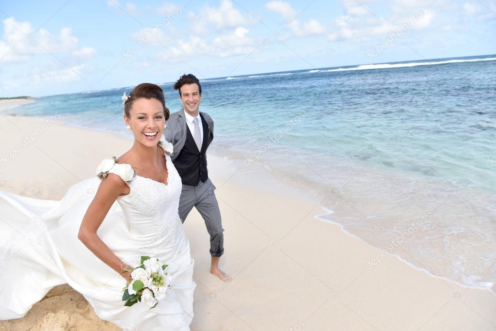 couple running on a caribbean beach