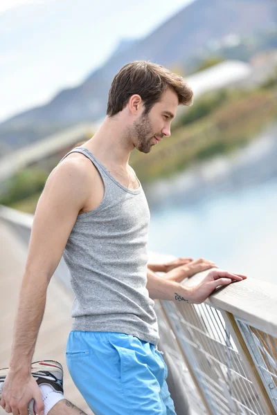 Man stretching out after running — Stock Photo, Image