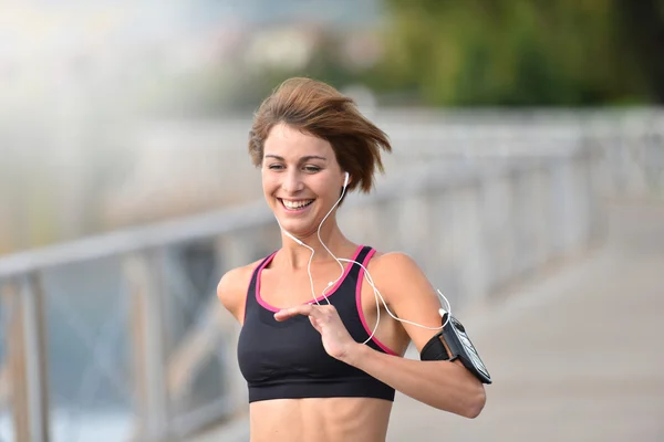 Athletic girl running outside — Stock Photo, Image