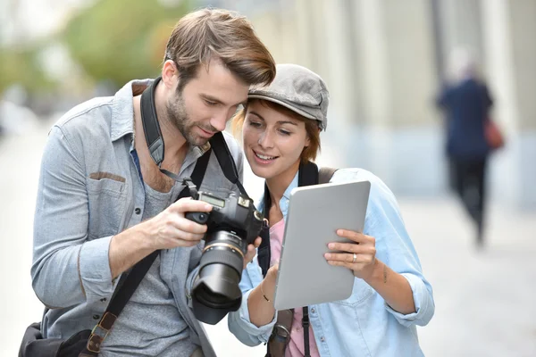Photographers checking shots — Stock Photo, Image