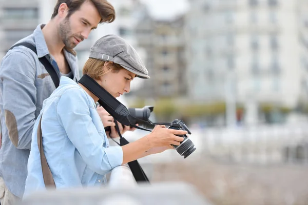 Photographers checking photo shots — Stock Photo, Image