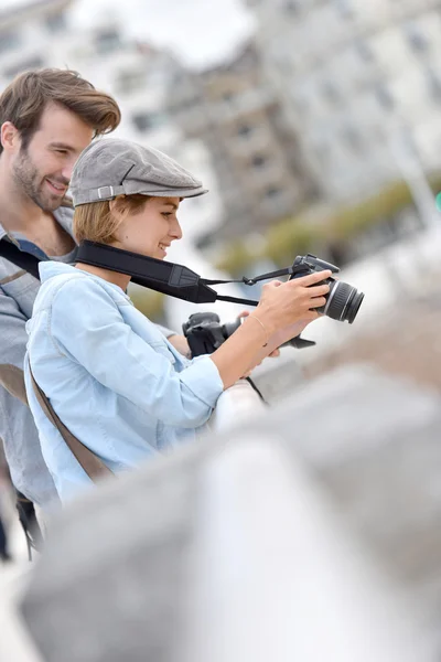 Photographers checking photo shots — Stock Photo, Image