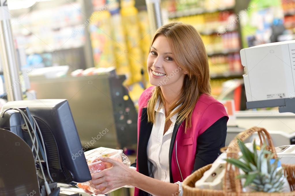 cashier working in grocery store