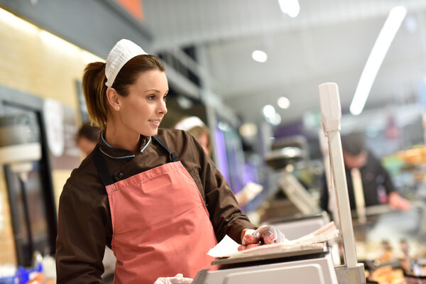 butcher serving sausages
