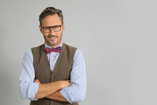 Stylish guy with eyeglasses and bow tie — Stock Photo, Image