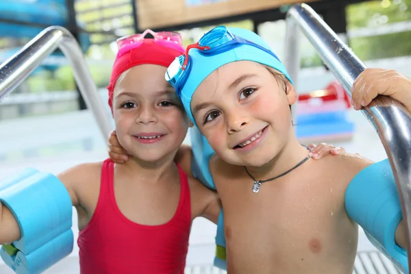 Little kids in the swimming-pool — Stock Photo, Image