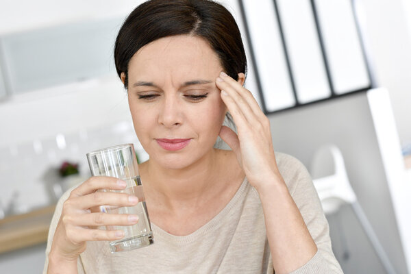 Mature woman having migraine