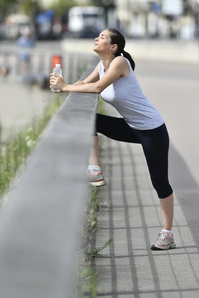 Woman relaxing after exercising — Stock Photo, Image