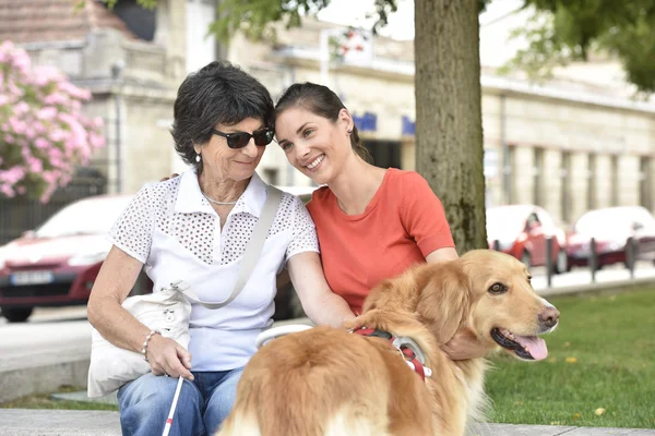 Blind woman and homecarer relaxing — Stock Photo, Image