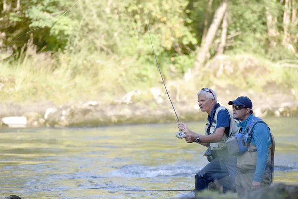 Pêcheur volant avec guide de pêche — Photo