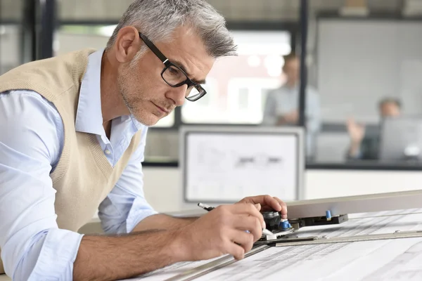 Architect sitting at drawing table — Stock Photo, Image