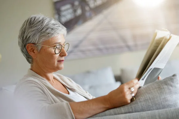 Senior Woman Reading Newspaper Relaxed Sofa — Stock Photo, Image