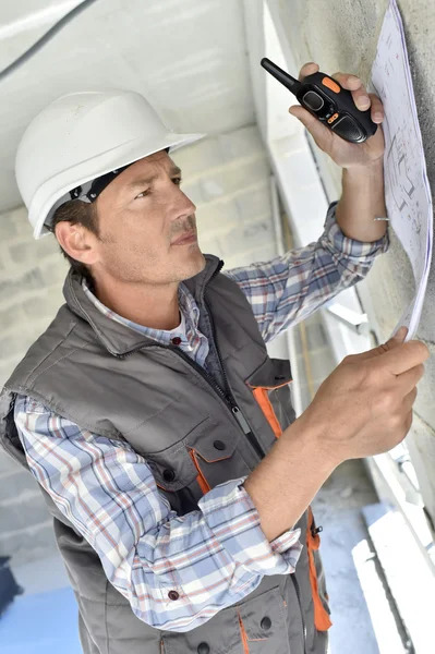 Engineer checking blueprint — Stock Photo, Image
