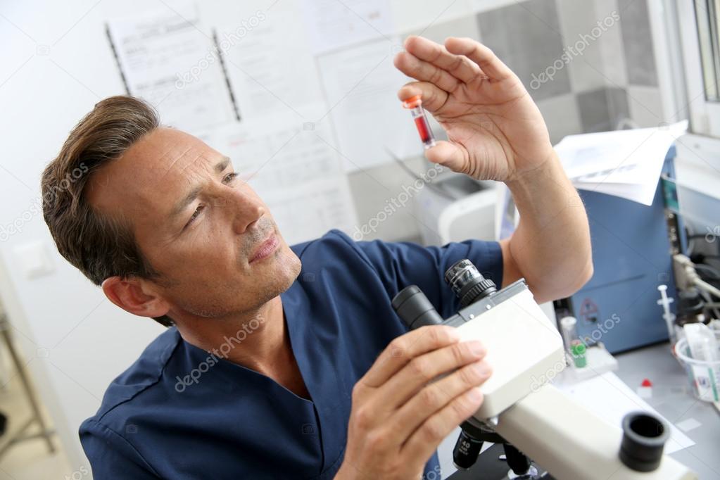 Doctor checking on blood sample
