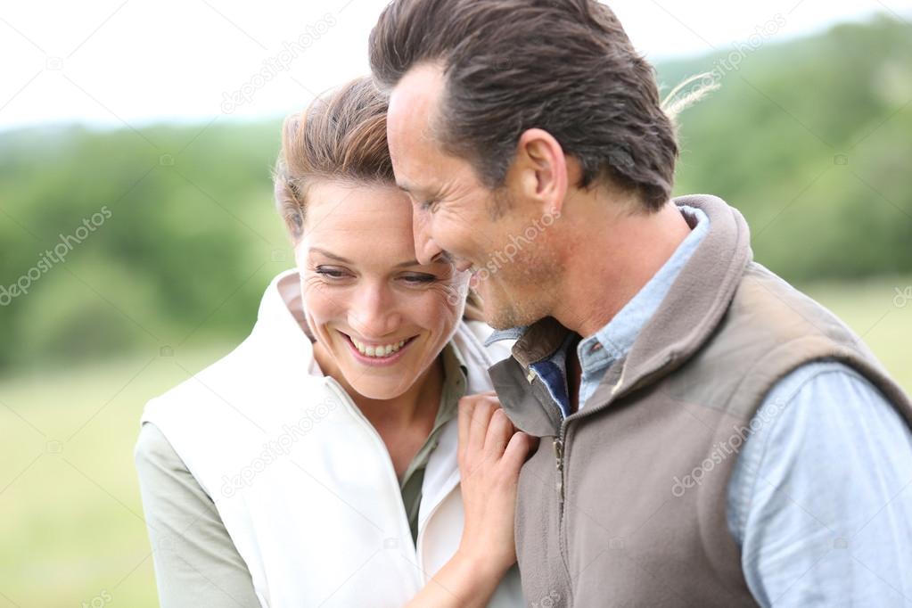 Couple walking in countryside