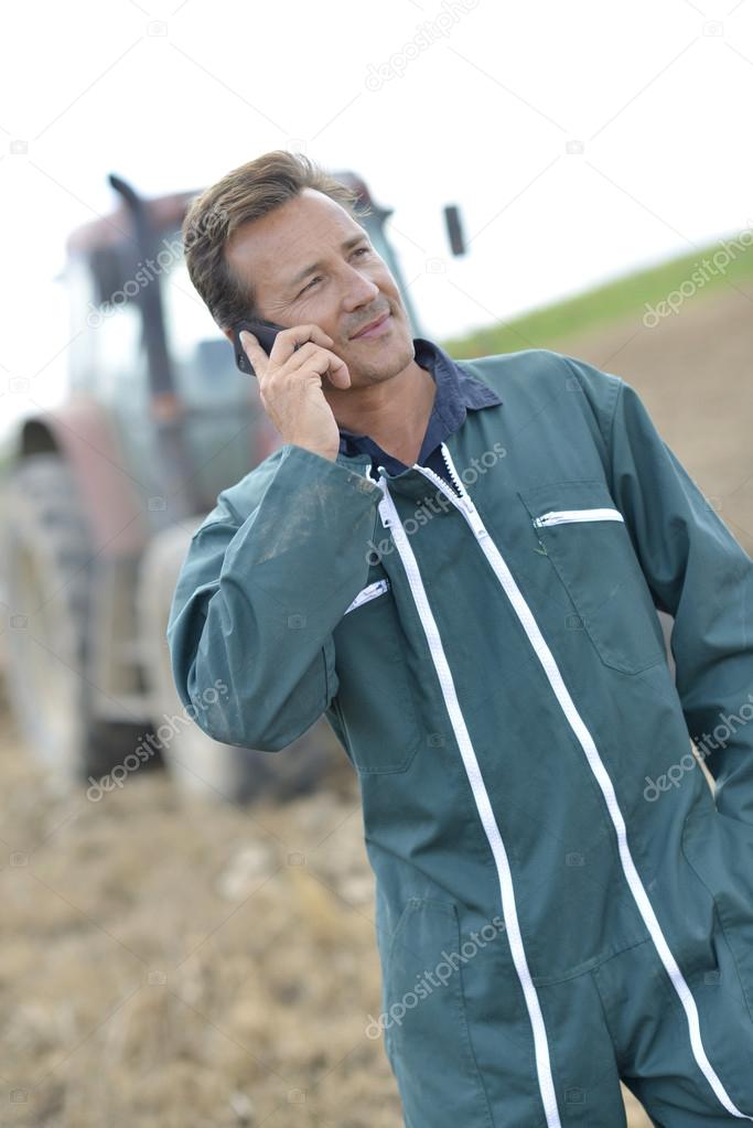 Farmer talking on mobile phone