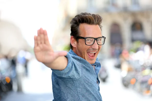 Guy with eyeglasses pointing at camera — Stock Photo, Image