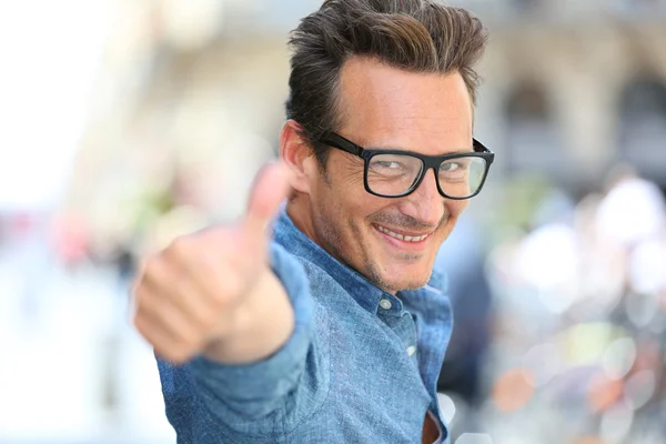 Cheerful guy showing thumbs up — Stock Photo, Image