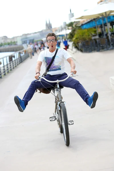 Man having fun riding bicycle — Stock Photo, Image