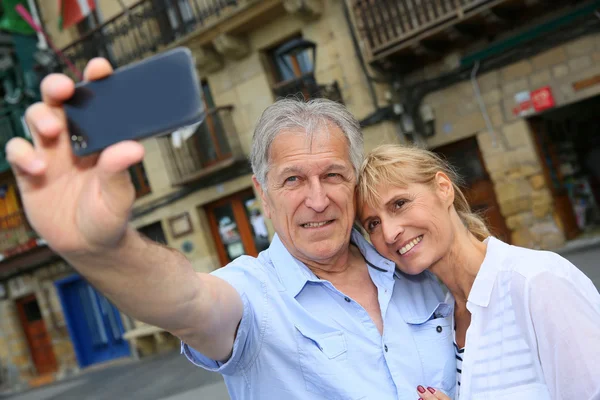 Touristen fotografieren sich selbst — Stockfoto