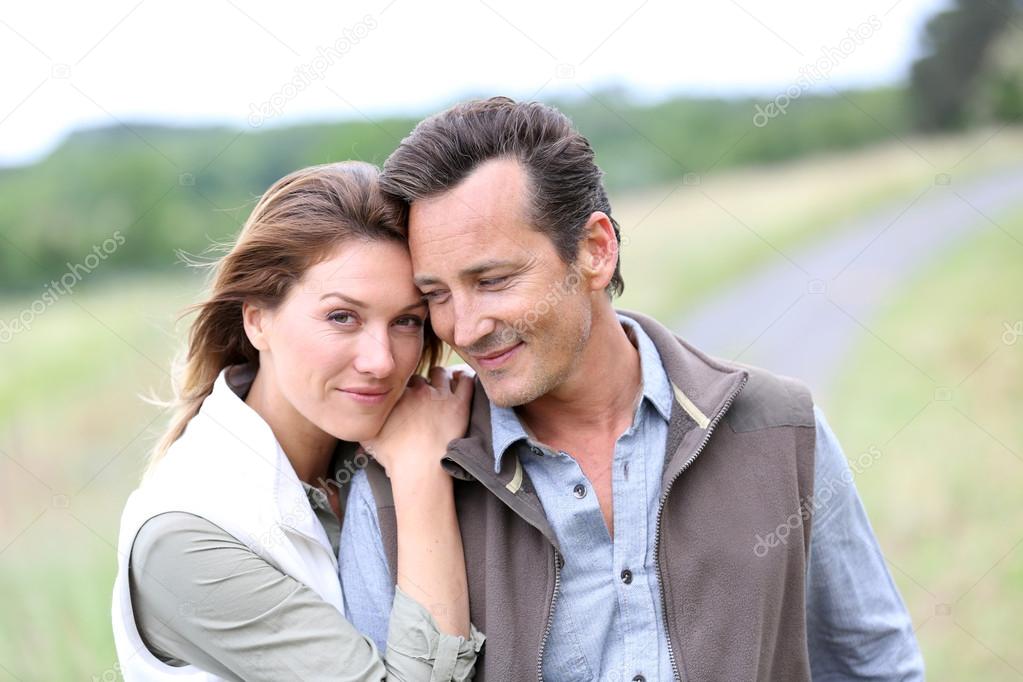 Couple walking in countryside