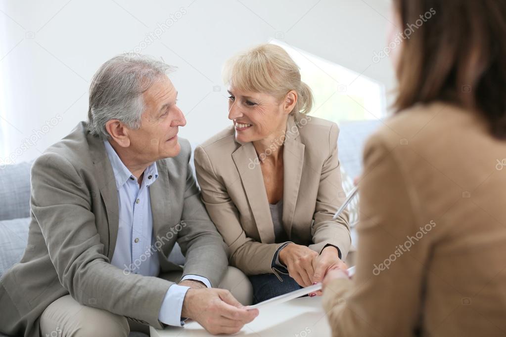 Couple meeting real estate agent