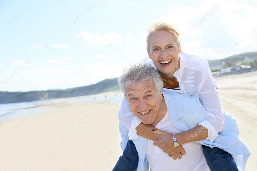 Man giving piggyback ride to wife