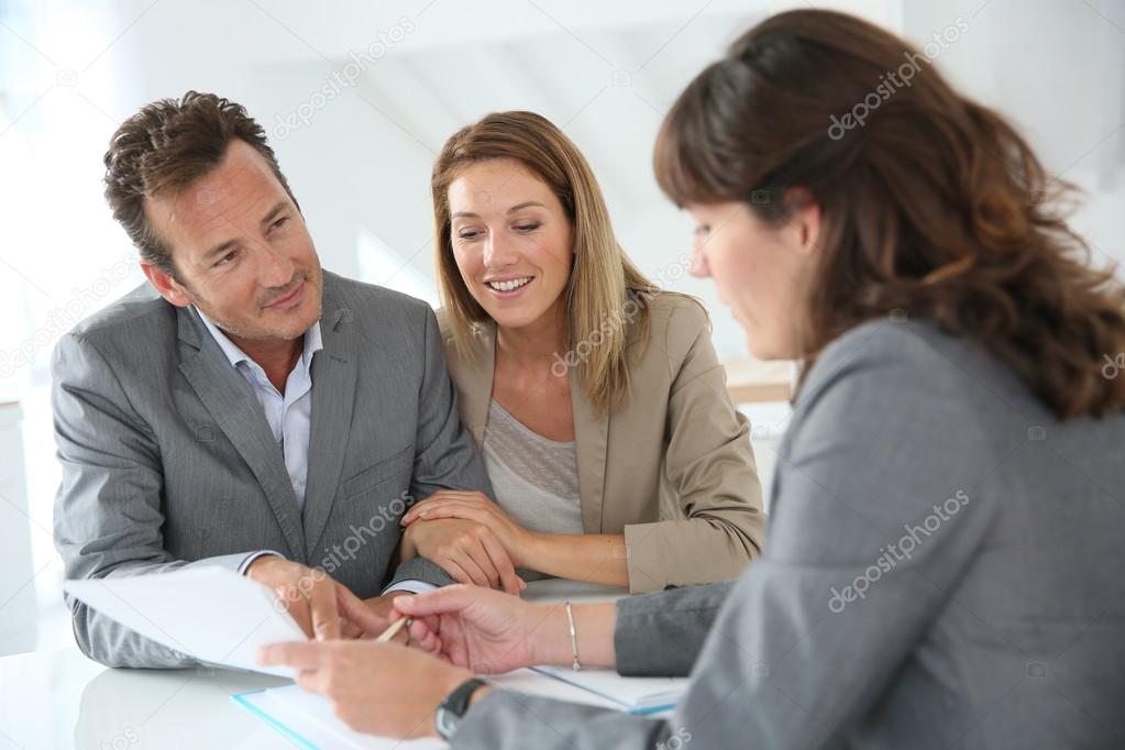 Couple meeting financial adviser