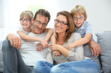 Family of four wearing eyeglasses clipart