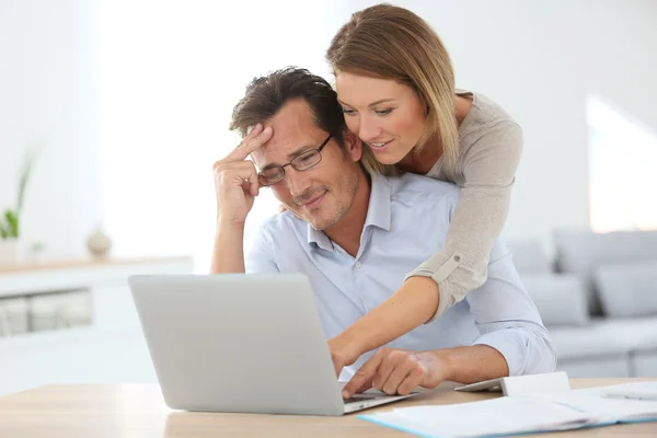 Woman trying to relax worried husband — Stock Photo, Image