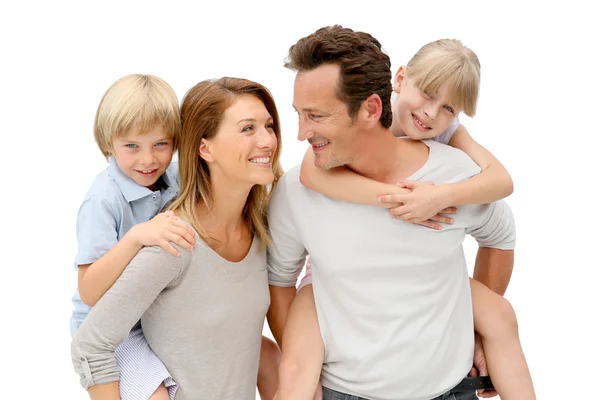 Parents giving piggyback ride to kids — Stock Photo, Image