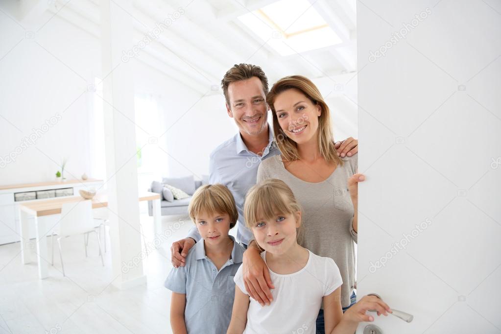 Family welcoming people at entrance door