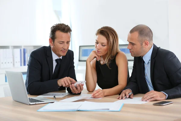 Business people looking at budget forecast — Stock Photo, Image