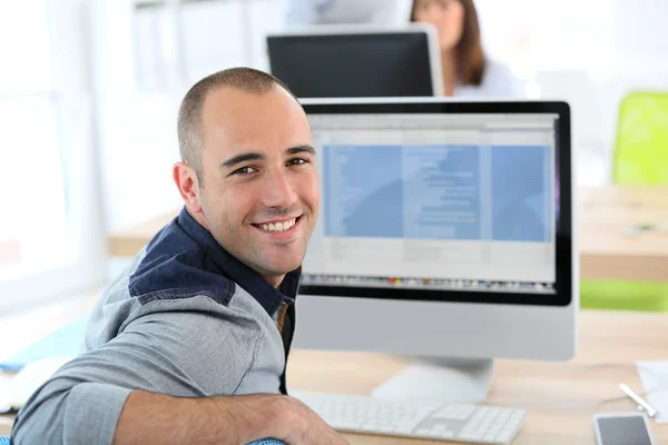 Student in front of desktop computer — Stock Photo, Image