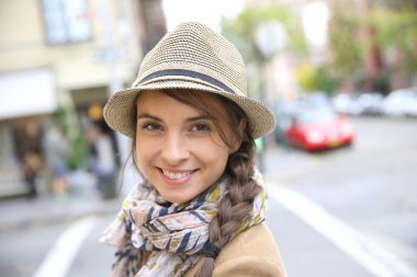 Smiling woman with scarf and hat clipart