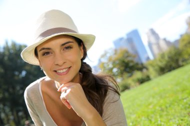 Trendy girl with hat in Central Park clipart