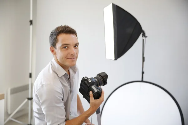 Photographer with lighting equipment — Stock Photo, Image